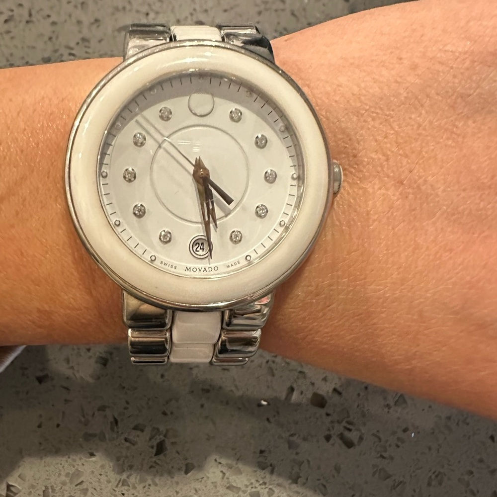Authentic MOVADO watch. Silver and white ceramic watch w/ diamonds on face.
